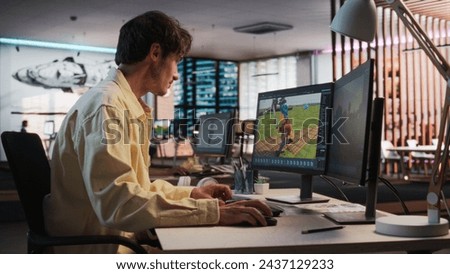 Caucasian Male Game Designer Using Desktop Computer With 3D Modeling Software To Design Unique Characters And World For Immersive RPG Video Game. Man Working In Game Development Company Diverse Office