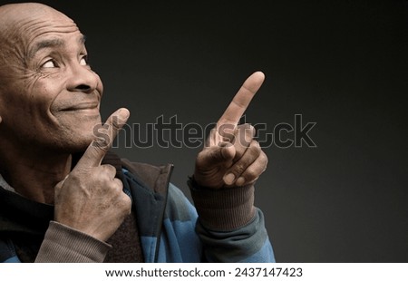 man pointing his finger with grey black background with people stock image stock photo