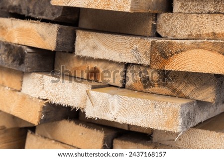 Rough wooden boards close up photo, stacked wood for rural construction