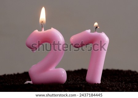 paraffin festive pink candles for cake in the form of numbers. holiday candles in the form of number 27