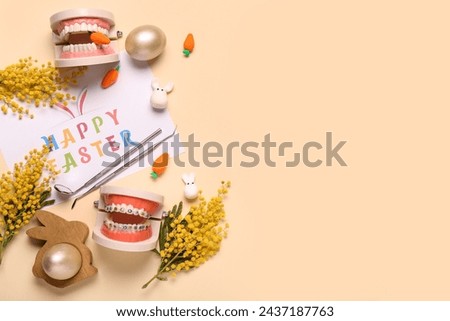 Composition with greeting card, dentist's tools, mimosa flowers and Easter decor on color background