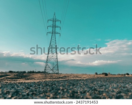 A picture of electric pole with blue sky and cloudy background 