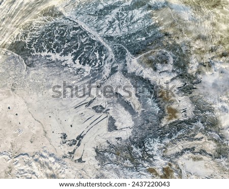 Snow in central Russia. Snow in central Russia. Elements of this image furnished by NASA. Royalty-Free Stock Photo #2437220043
