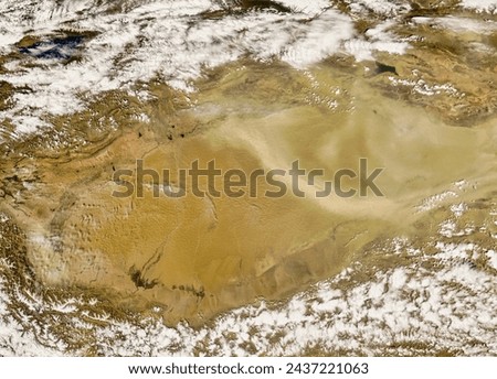 Dust storm in Taklimakan Desert, Western China. Dust storm in Taklimakan Desert, Western China. Elements of this image furnished by NASA.