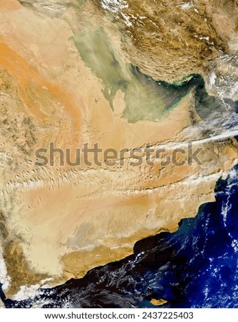 Dust over the Arabian Peninsula. Starting in Iraq and northern Saudi Arabia, dust storms spread southward across the Arabian Peninsula. Elements of this image furnished by NASA. Royalty-Free Stock Photo #2437225403