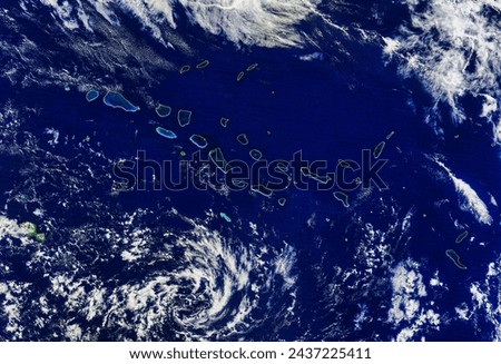 Archipel des Tuamotu. Acquired May 19, 2010, this naturalcolor image shows the northwestern portion of French Polynesias Tuamotu Archipelago. Elements of this image furnished by NASA.