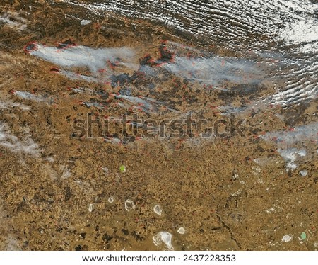Fires in central Russia. Fires in central Russia. Elements of this image furnished by NASA. Royalty-Free Stock Photo #2437228353