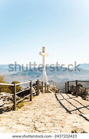 Vertical photograph of the cross of the castle of Santa Catalina in Jaén.Jaen interior paradise.Places to visit in Jaen capital.