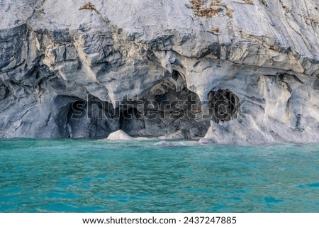 Photography of Marble Cathedral, a natural marble rock formation in General Carreras Lake with striking colors and shapes.