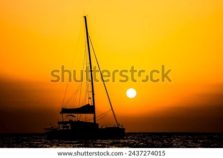 Photo Picture of a Sail Boat Silhouette at Sunset