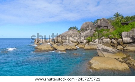 Felicite Island, close to La Digue, Seychelles. Aerial view of tropical coastline on a sunny day. Royalty-Free Stock Photo #2437275721