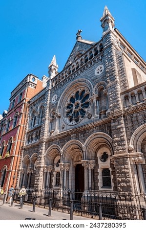 A place of religious devotion in the heart of the hectic Irish capital. This wonderful place of worship, dating back to the 1700s, has a splendid facade with a central rose window. Royalty-Free Stock Photo #2437280395