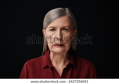 Personality concept. Portrait of emotional woman on black background