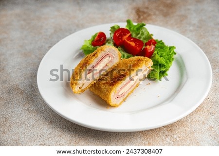 cutlet cordon bleu chicken meat, ham slice, cheese fresh food tasty eating cooking appetizer meal food snack on the table copy space food background rustic top view Royalty-Free Stock Photo #2437308407