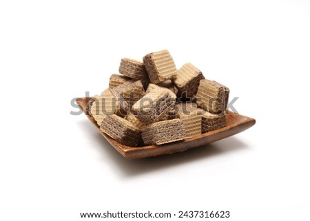 Bite-size wafers isolated on a white background. Royalty-Free Stock Photo #2437316623