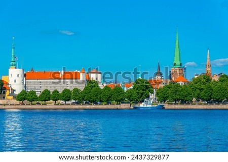 Panorama of riga including the Riga castle and Saint James church, Latvia. . Royalty-Free Stock Photo #2437329877