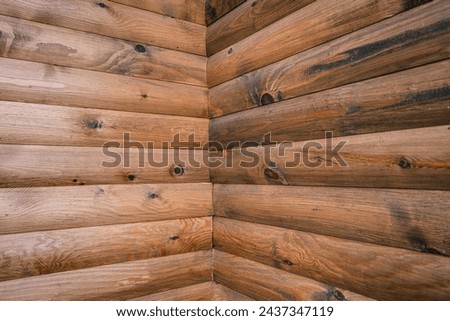 Corner of blockhouse from logs. Texture of logs from the wooden house Royalty-Free Stock Photo #2437347119