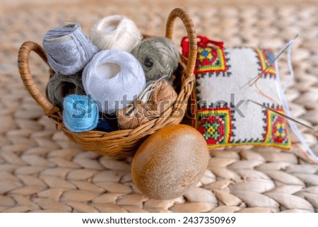 clothing repair materials, Wooden darning mushroom, Yarn and Thread, Exploring Textile Restoration, Contemporary Knitting and Crocheting Styles Royalty-Free Stock Photo #2437350969