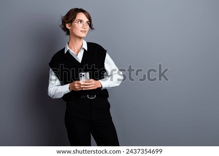 Photo of stunning confident lady banker economist wear trendy clothes look empty space banner offer isolated on gray color background