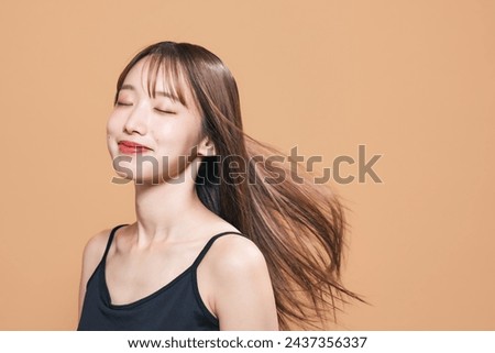 Beauty concept of young Asian woman. Skin care. Hair care. Cosmetics. Royalty-Free Stock Photo #2437356337