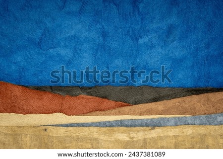 abstract nighttime landscape created with sheets of textured colorful handmade paper