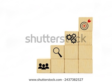 The wooden block with a target icon. Concept of Business success goals and strategy planning to success.