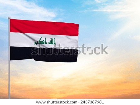 3D illustration of a Iraq flag extended on a flagpole and in the background a beautiful sky with a sunset