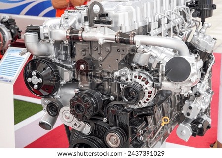 Close-up of a new complex automotive internal combustion engine Royalty-Free Stock Photo #2437391029