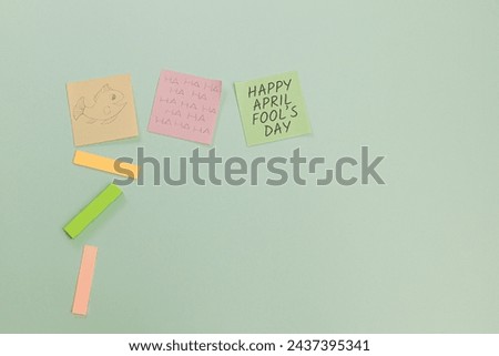 Concept of office on April Fool's Day, sticky notes on the table