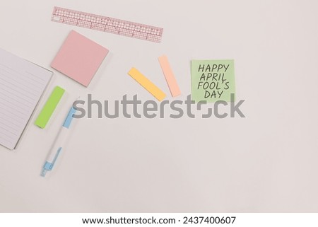 Concept of office on April Fool's Day with stationery tools on the table