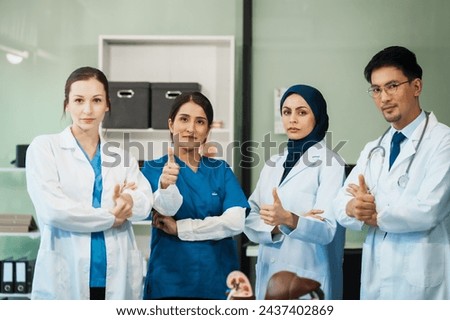 A dedicated team of doctors and healthcare professionals working collaboratively in a hospital setting, ensuring quality patient care with expertise and compassion. Asian, Caucasian and muslim people