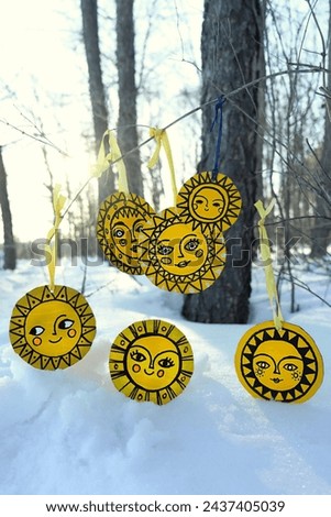 traditional festival of Maslenitsa. handmade amulets of sun image in forest. festive symbol, Decorations for Slavic holiday Shrovetide. pagan spring holiday