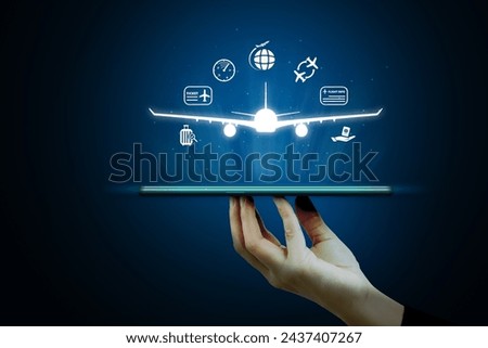 Flight ticket booking concept with a person using a smartphone Royalty-Free Stock Photo #2437407267