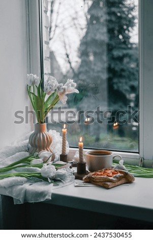 Spring aesthetics on windowsill, home interior.