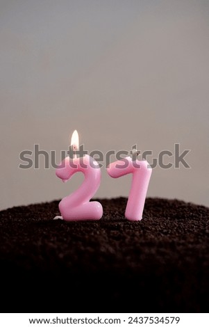 paraffin festive pink candles for cake in the form of numbers. holiday candles in the form of number 27
