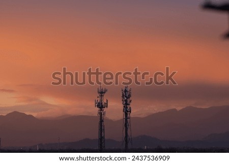 Shot on sunset golden hour of two antennas as subject. Matching the beauty of nature with human constructions. #linking