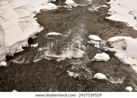 Cold river with snow water hokkaido Japan. High quality photo