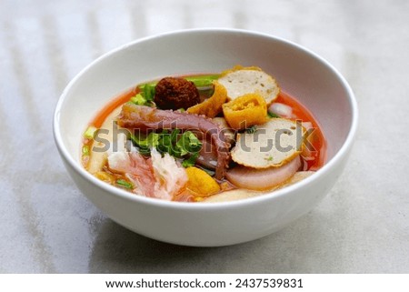 A bowl of pink flat noodles Royalty-Free Stock Photo #2437539831
