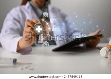 Female doctor holding stethoscope with medical icons for the Health insurance concept
