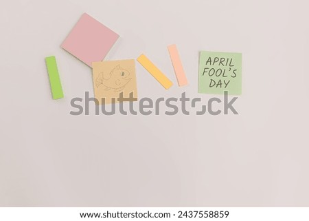 Concept of office on April Fool's Day with stationery, sticky notes on the table