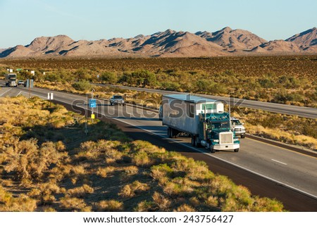 Traffic moving across America on interstate I-10, Arizona Royalty-Free Stock Photo #243756427