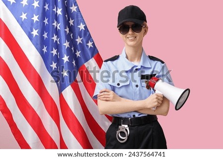 Female police officer with megaphone and flag of USA on pink background