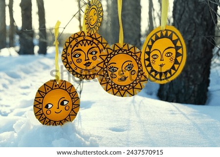 handmade amulets of sun image in forest. traditional festival of Maslenitsa. festive symbol, Decorations for Slavic holiday Shrovetide. pagan spring holiday
