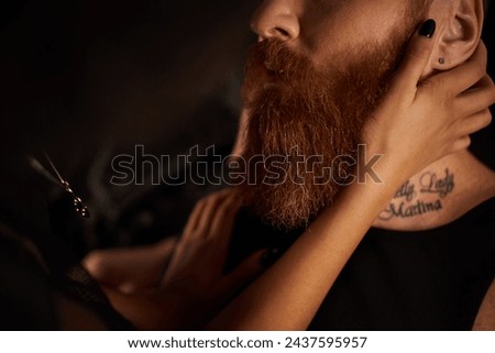 passionate moment of multiethnic couple, cropped african american woman seducing tattooed man Royalty-Free Stock Photo #2437595957