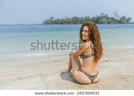 A girl relaxes during beach holidays, tropical paradise.