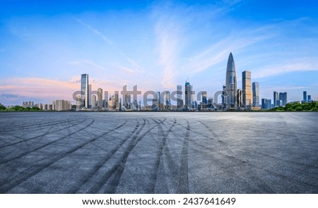 Asphalt road square and urban skyline with modern buildings at sunrise in Shenzhen
