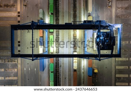 RTG cranes are lifting containers at the port.

 Royalty-Free Stock Photo #2437646653