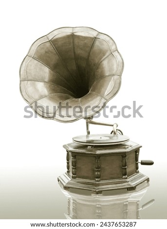 Vintage Gramophone with disc isolated on grunge background Royalty-Free Stock Photo #2437653287