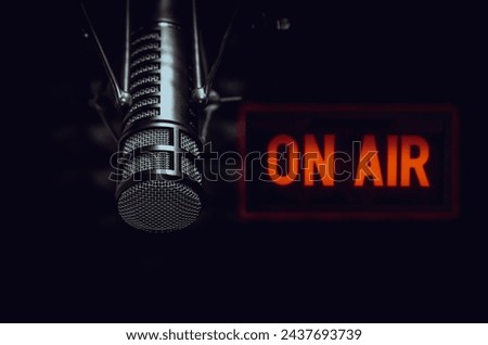 Professional microphone and on air sign Royalty-Free Stock Photo #2437693739