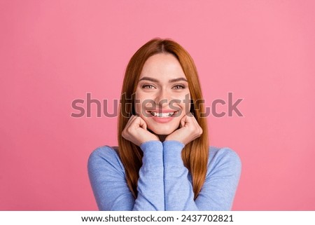 Portrait of toothy beaming girl with foxy hairdo wear blue pullover keep hands on cheeks smiling isolated on pink color background Royalty-Free Stock Photo #2437702821